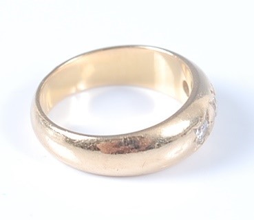 Lot 2630 - A yellow metal Gypsy set diamond dress ring,...