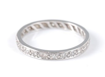 Lot 2635 - A white metal diamond eternity ring,...