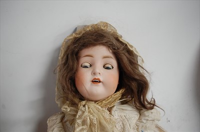 Lot 2024 - A large German bisque head doll, having...