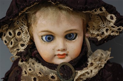 Lot 2060 - An unmarked bisque head and shouldered doll,...