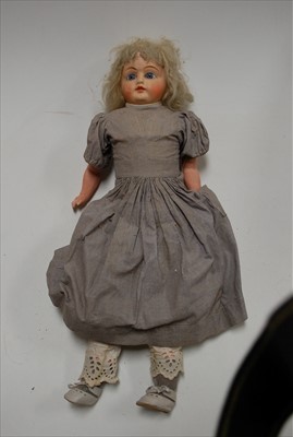 Lot 108 - An unmarked wax head doll, having fixed blue...