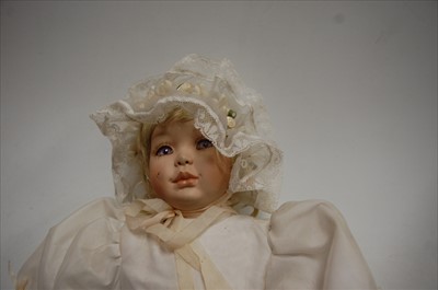Lot 108 - An unmarked wax head doll, having fixed blue...