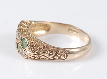 Lot 2640 - A 9ct yellow gold, emerald and diamond carved...