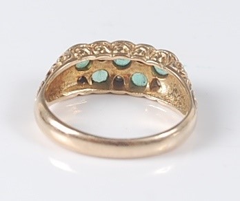 Lot 2640 - A 9ct yellow gold, emerald and diamond carved...