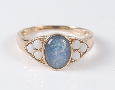 Lot 2638 - A 9ct yellow opal triplet dress ring, the opal...