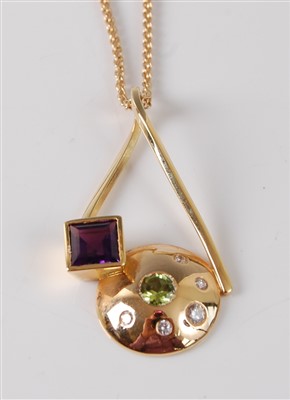 Lot 2644 - An 18ct yellow gold abstract pendant,...