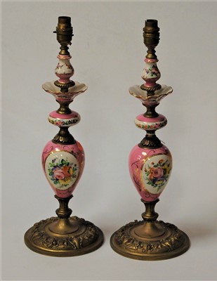 Lot 2 - A pair of continental gilt metal and porcelain...