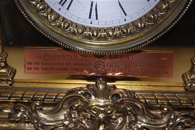 Lot 5 - A brass mantel clock having applied cast...