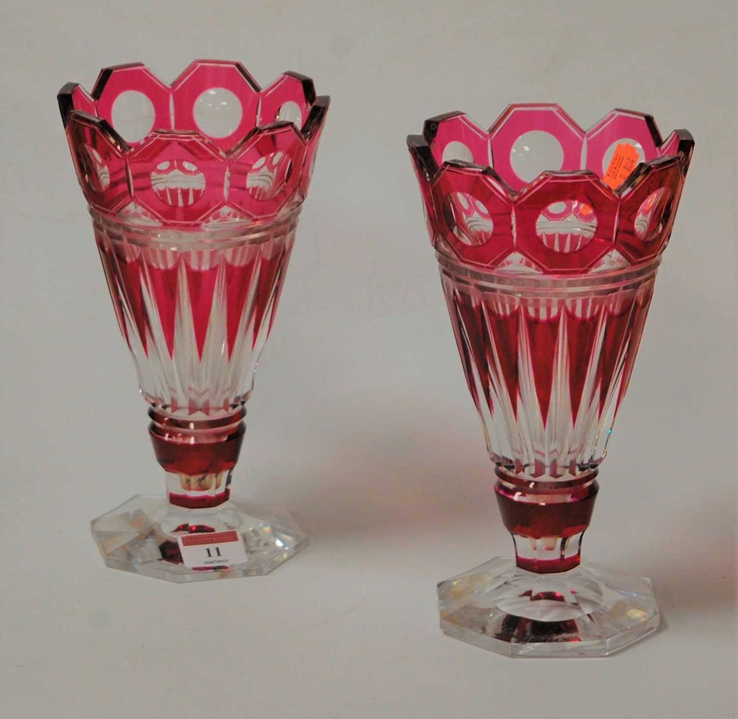 Lot 11 - A pair of Bohemian ruby overlay vases of...