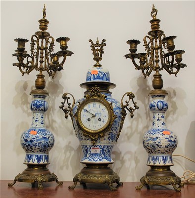 Lot 26 - A Dutch Delft earthenware and brass mounted...