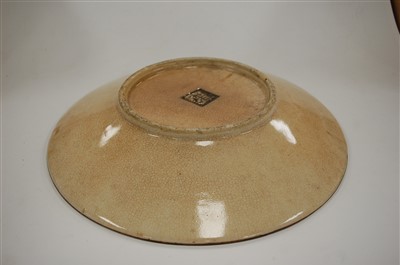 Lot 53 - A Chinese stoneware charger, decorated in the...