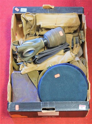 Lot 88 - A World War II period gas mask, assorted army...