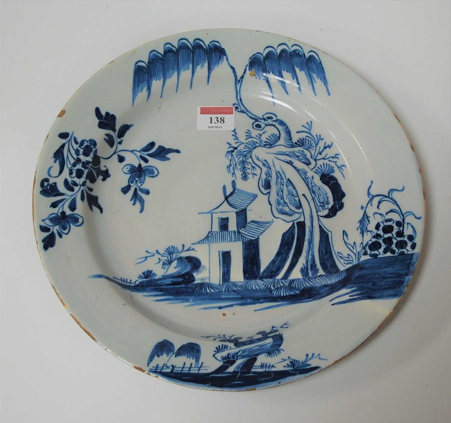 Lot 138 - An 18th century English Delft small charger,...