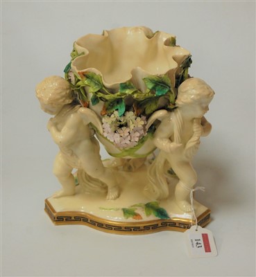 Lot 143 - A Moores soft paste porcelain cherub table...