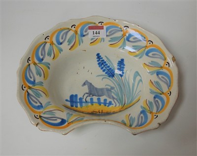 Lot 144 - A 19th century French faience barber bowl 27cm