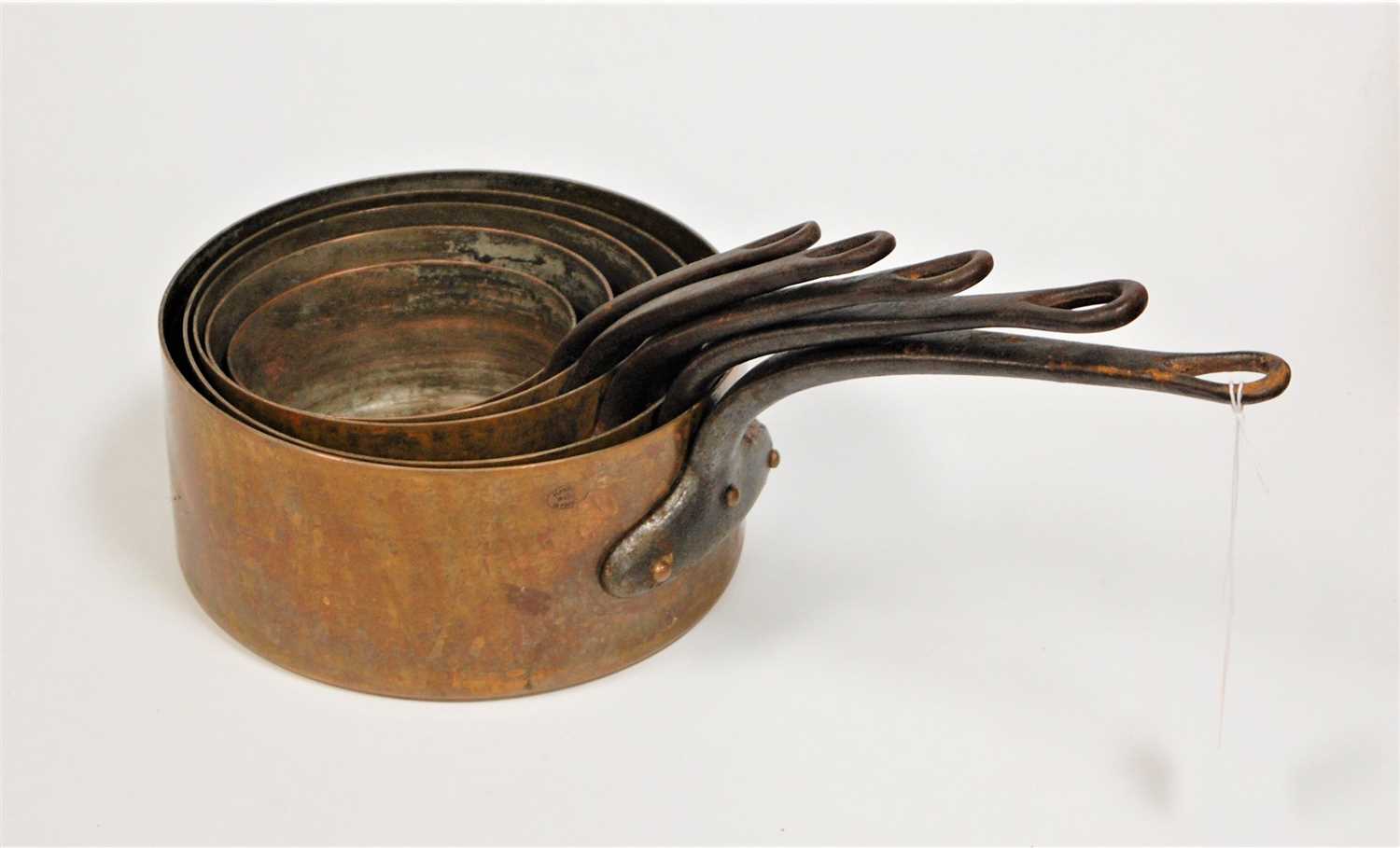 Lot 155 - A set of five French copper and iron handled...