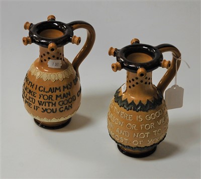 Lot 206 - A pair of Doulton Lambeth puzzle jugs, each...