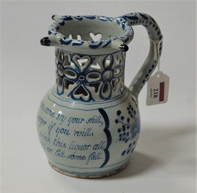Lot 218 - An 18th century English Delft puzzle jug,...