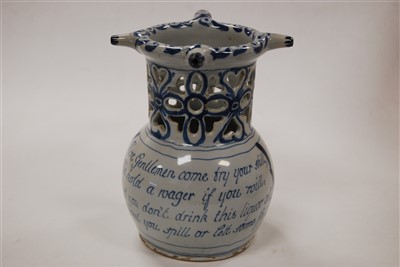 Lot 218 - An 18th century English Delft puzzle jug,...