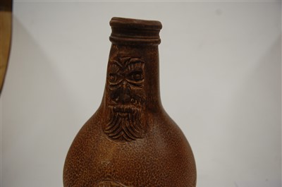 Lot 241 - A 17th century stoneware bellamine mask jug, 23cm