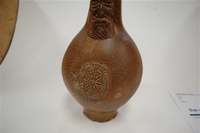 Lot 241 - A 17th century stoneware bellamine mask jug, 23cm