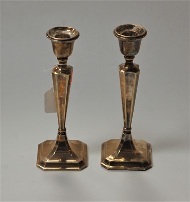Lot 273 - A pair of 20th century silver candlesticks,...