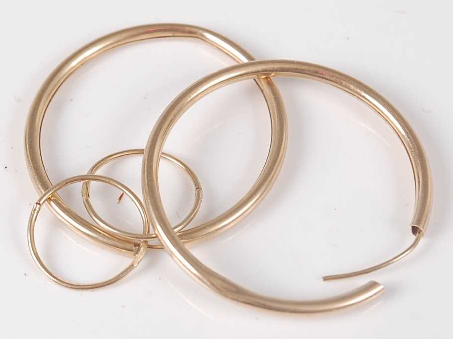 Lot 412 - A pair of hollow 9ct gold hoop earrings, 3.4cm;...
