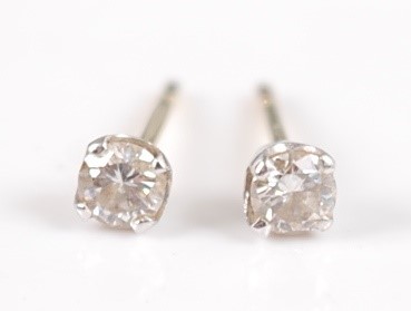 Lot 2655 - A pair of yellow metal diamond ear studs, each...