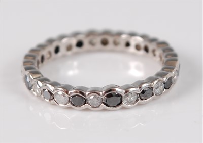 Lot 2660 - A white metal diamond eternity ring, the 30...