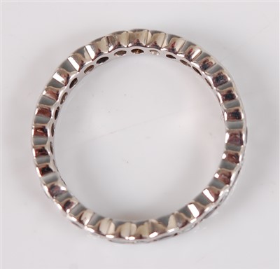 Lot 2660 - A white metal diamond eternity ring, the 30...