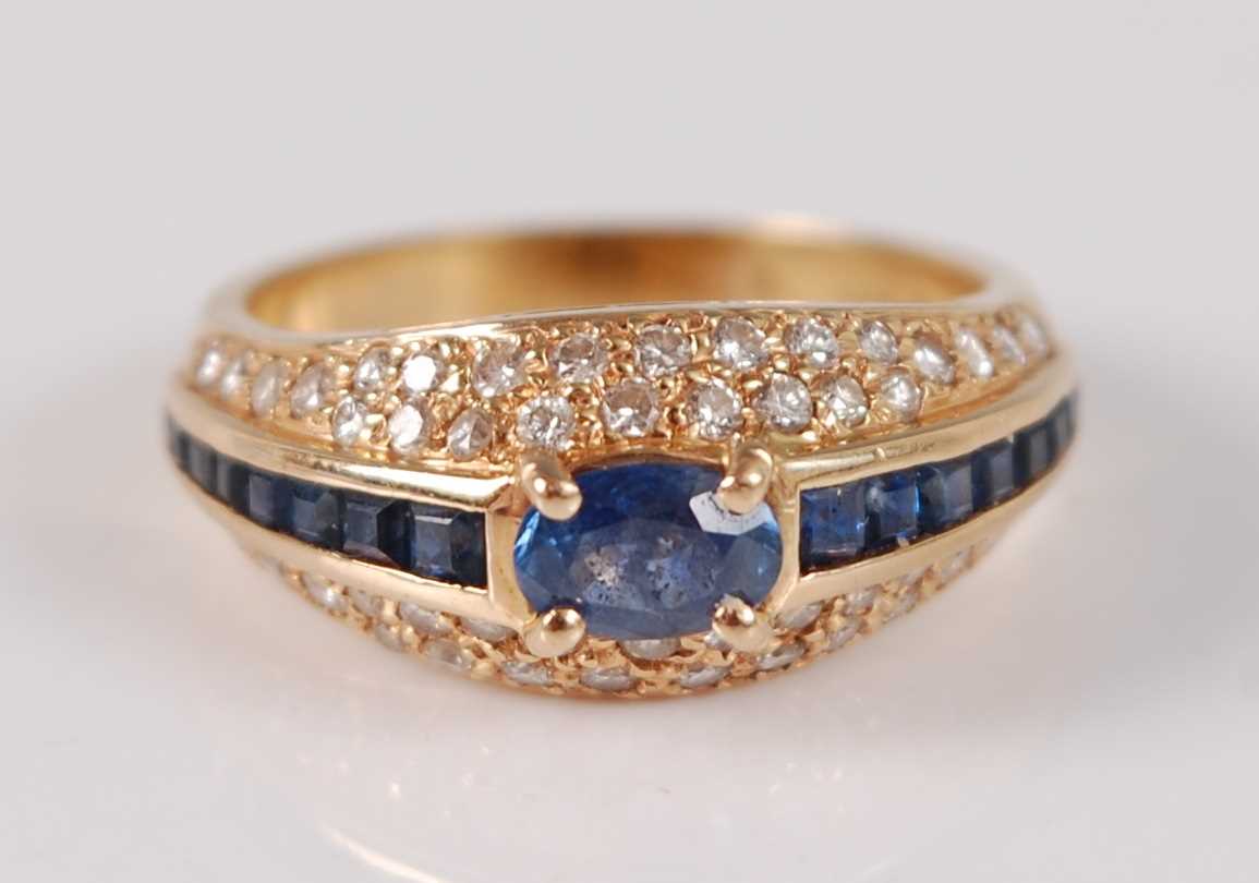 Lot 2665 - An 18ct yellow gold, sapphire and diamond...