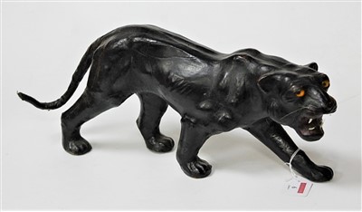 Lot 6 - A 20th century leather clad model of a puma in...