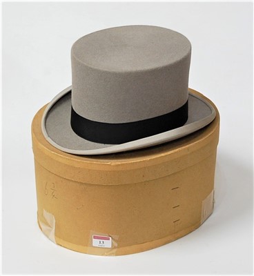 Lot 13 - An early 20th century grey felt top hat...