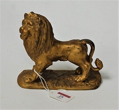 Lot 25 - A Victorian gilt metal figure of a lion in...