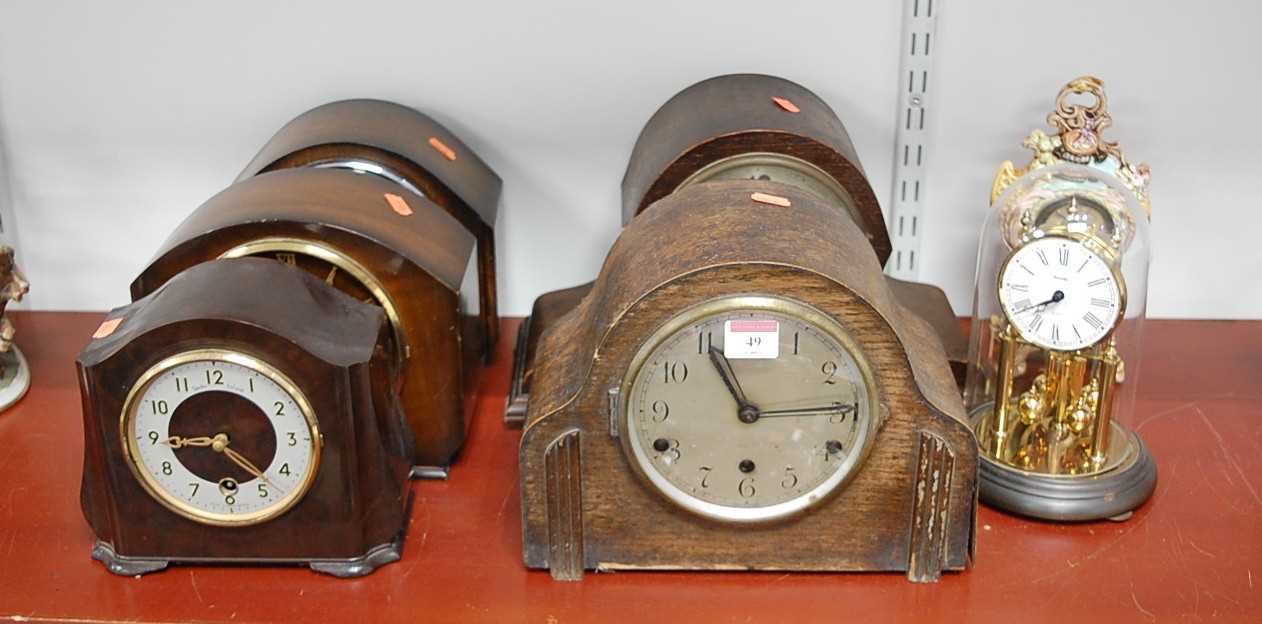 Lot 49 - A 1940s oak cased mantel clock, having a...