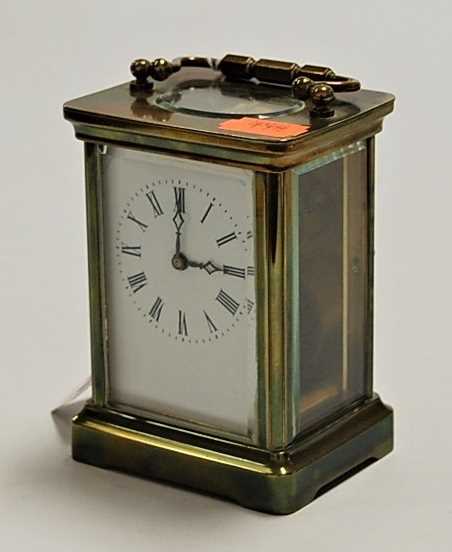 Lot 231 - A lacquered brass cased carriage clock having...