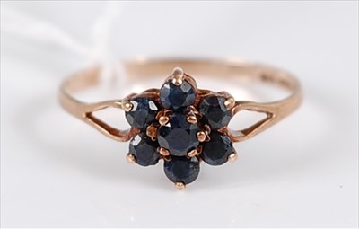Lot 311 - A 9ct sapphire cluster ring, with split...