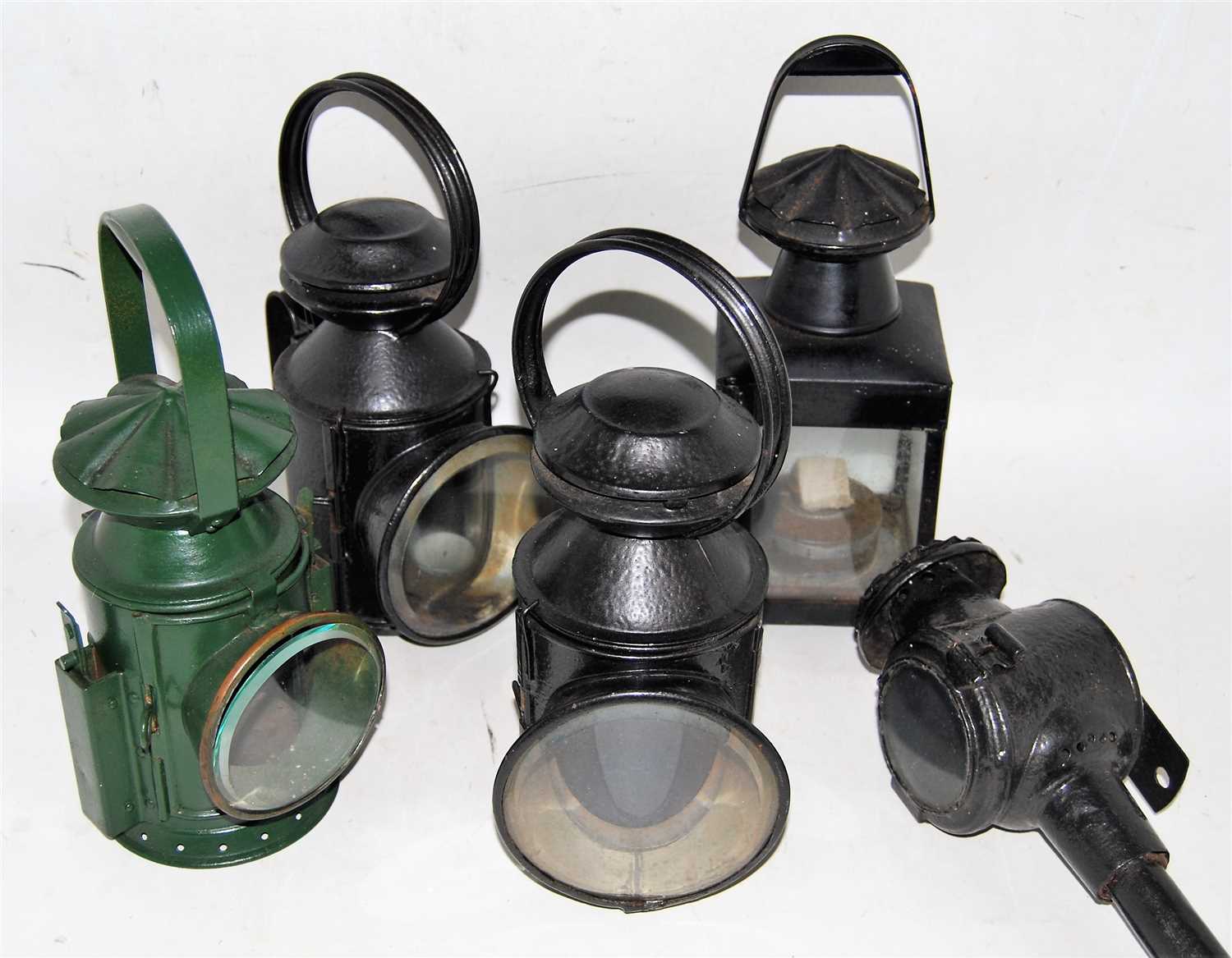 Lot 25 - Three railway hand lamps, all complete with...