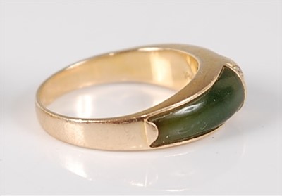 Lot 2678 - A yellow metal, spinach jade and diamond ring,...