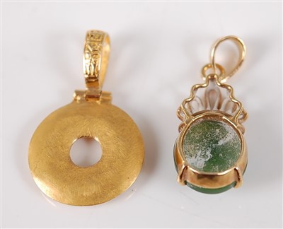 Lot 2680 - A Chinese yellow metal pendant, of ring shape,...