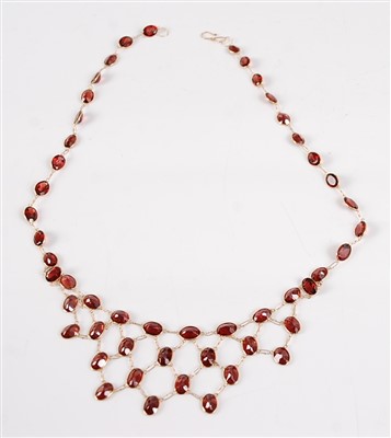 Lot 2682 - A contemporary 18ct gold and garnet necklace,...