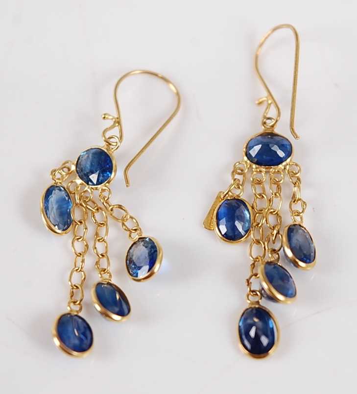 Lot 2683 - A pair of yellow metal and blue sapphire ear...