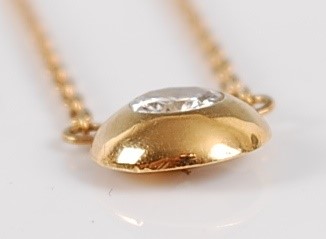 Lot 2691 - A contemporary 18ct gold diamond pendant, the...