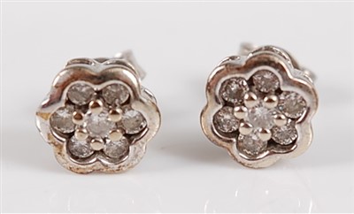 Lot 2714 - A pair of 9ct white gold diamond ear studs,...