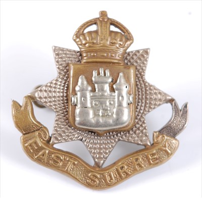 Lot 25 - An East Surrey Regiment Officer's white metal and gilt cap badge