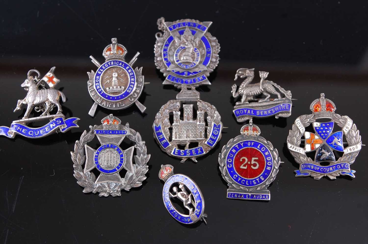 Lot 28 - A collection of nine silver and enamelled sweetheart badges to include