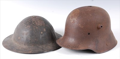 Lot 323 - A British Army M1916 Brodie helmet, together...