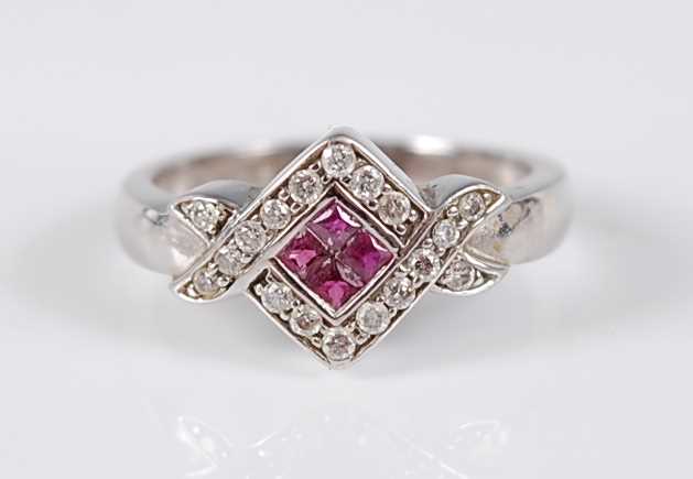 Lot 2740 - A 9ct white gold crossover style ruby and...