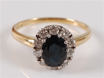 Lot 2753 - An 18ct yellow and white gold, sapphire and...