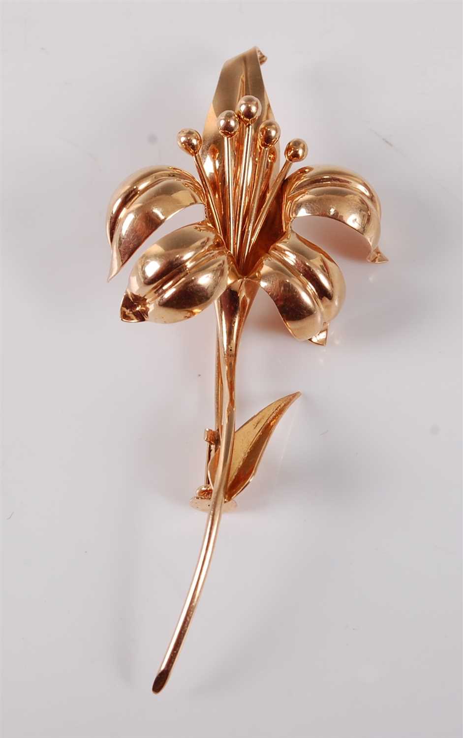 Lot 2766 - A contemporary yellow metal flower brooch,...